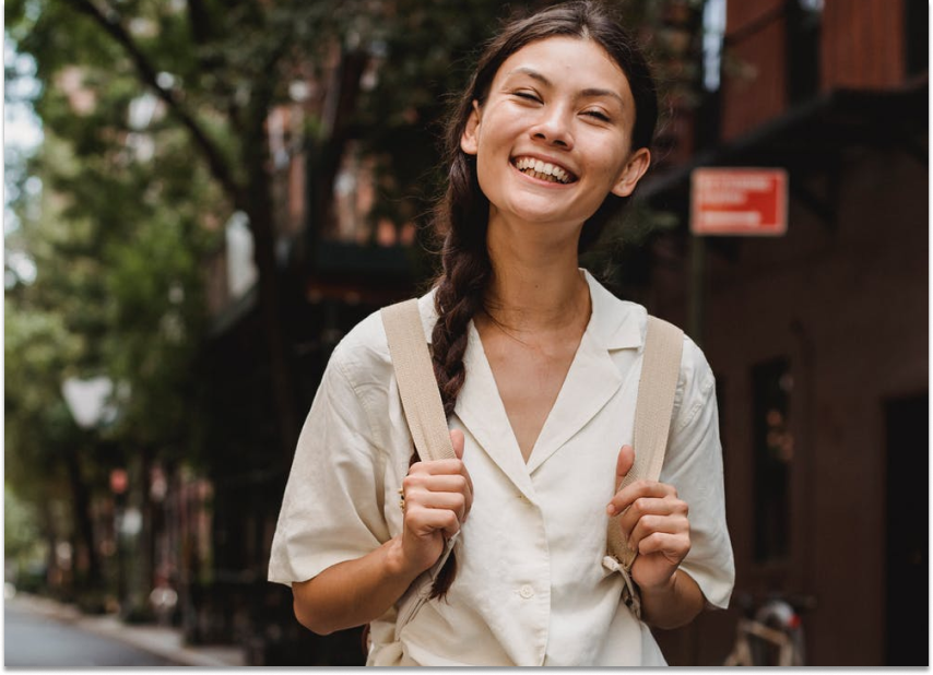 Student with backpack smiling